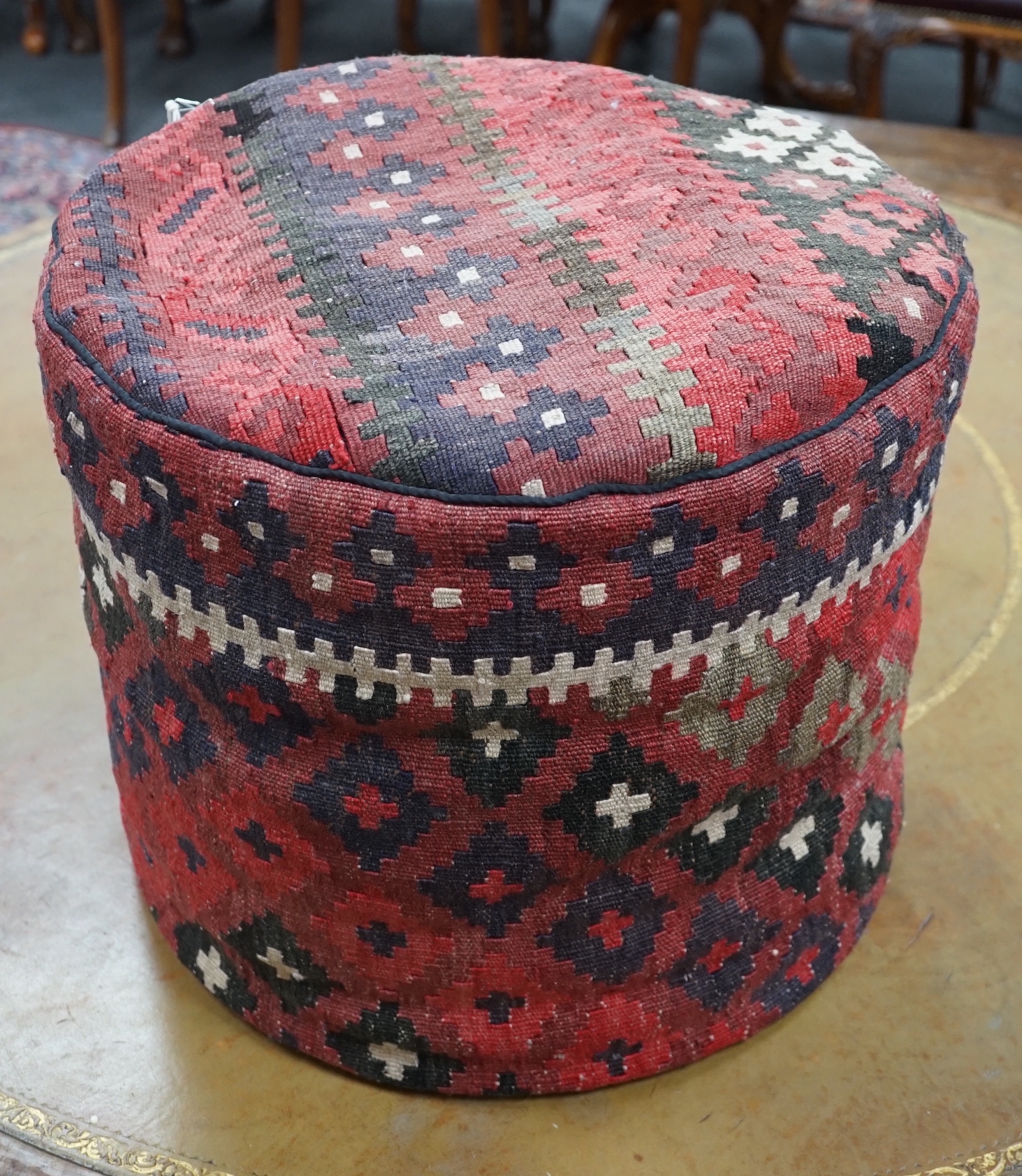 A circular kilim pouffe, diameter 45cm, height 40cm